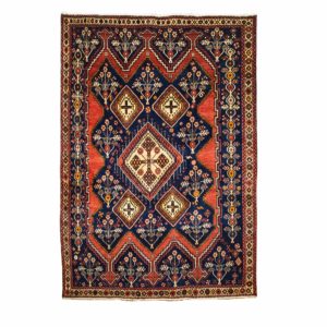 Persian Sirjan Rug with Red geometric design.